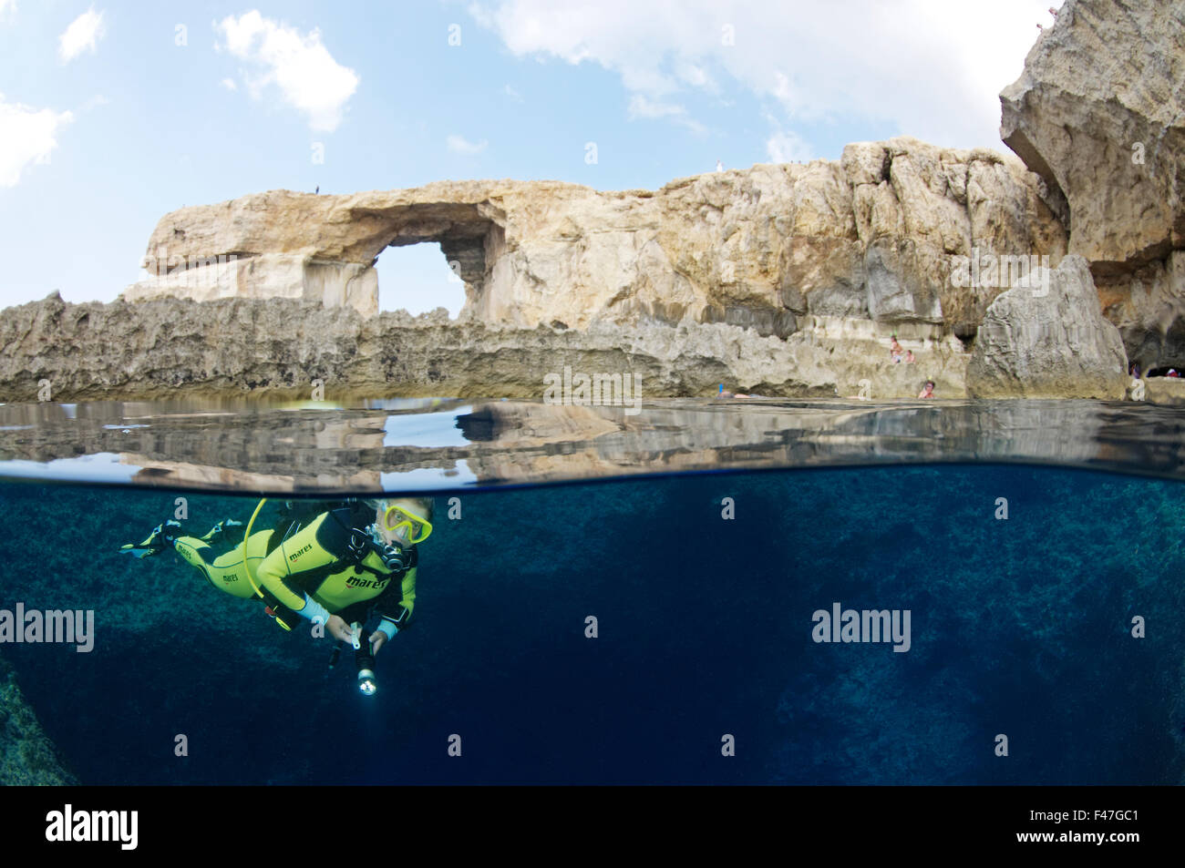 Azure Window and scuba diver, splitlevel picture, Gozo, Malta, South Europe, Mediterranean Sea Stock Photo