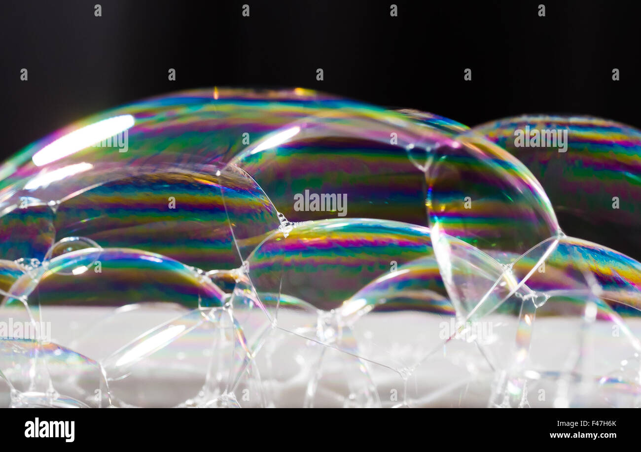 Iridescence in washing up bubbles Stock Photo