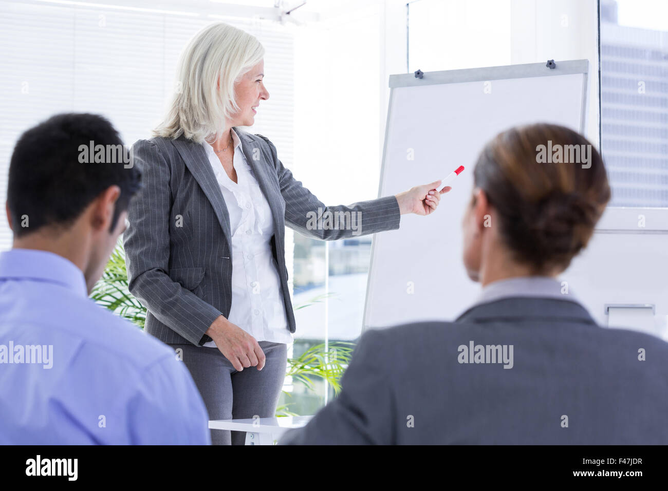 Business team looking at white screen Stock Photo - Alamy