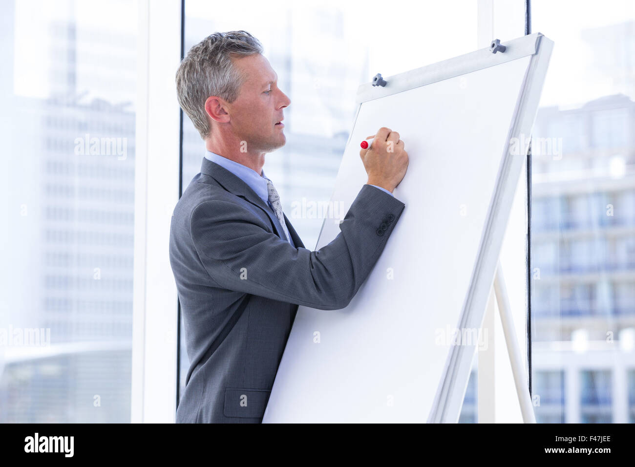businessman write on whiteboard Stock Photo Alamy
