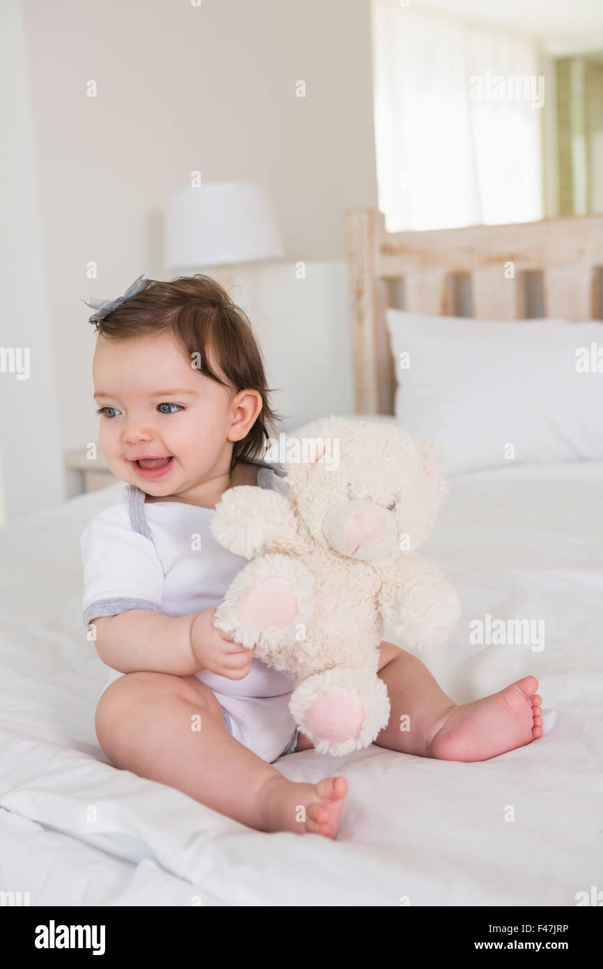 Beautiful cute baby girl with her teddy bear Stock Photo - Alamy