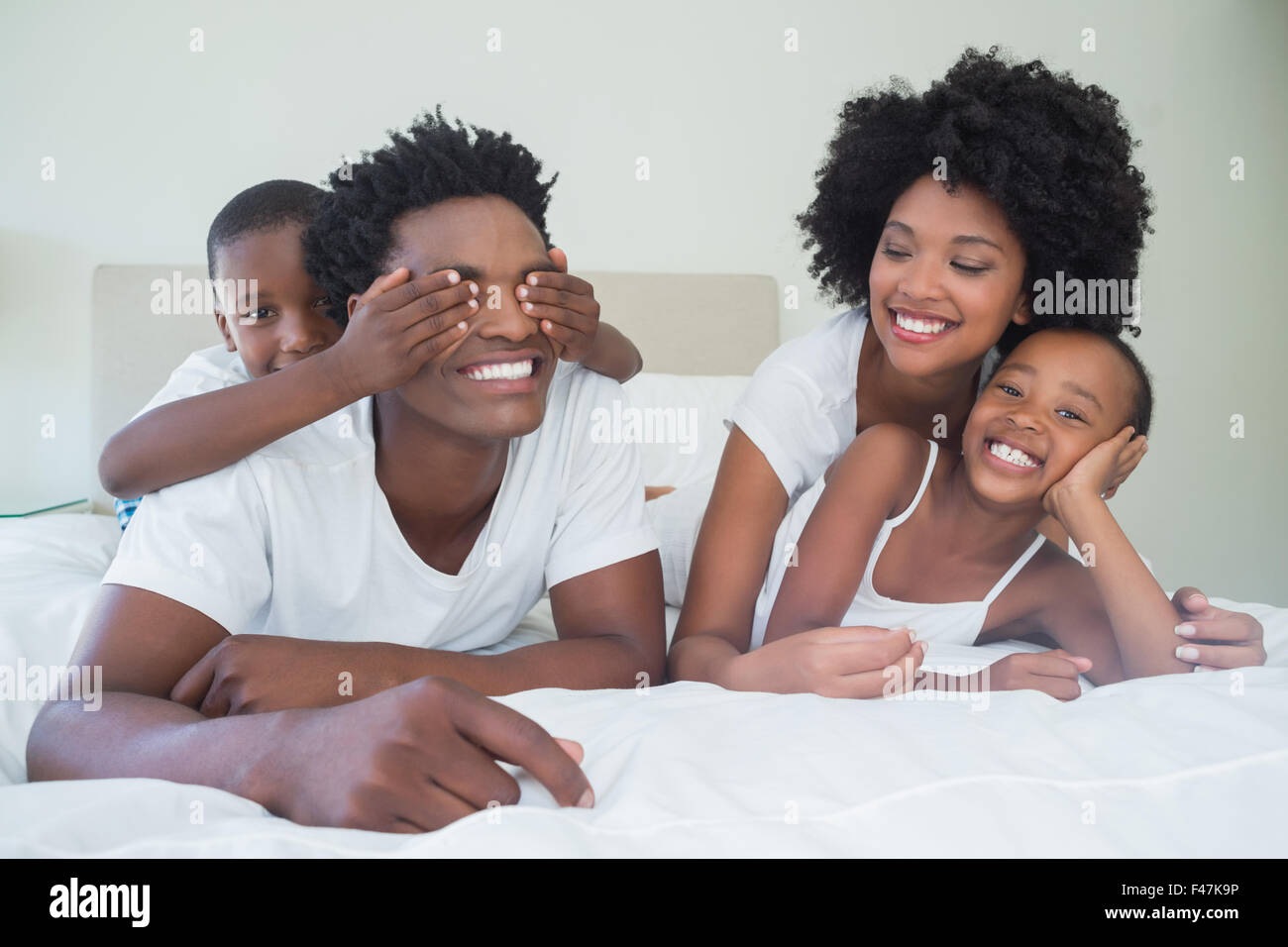 Happy family having fun together Stock Photo - Alamy