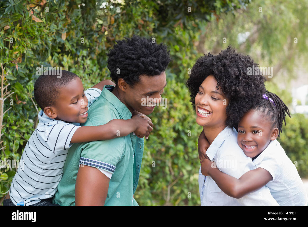 Happy family having fun together Stock Photo - Alamy