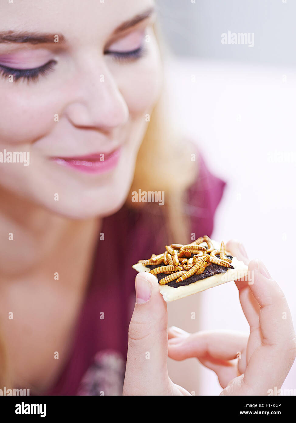 Woman eating insect closeup hi-res stock photography and images - Alamy