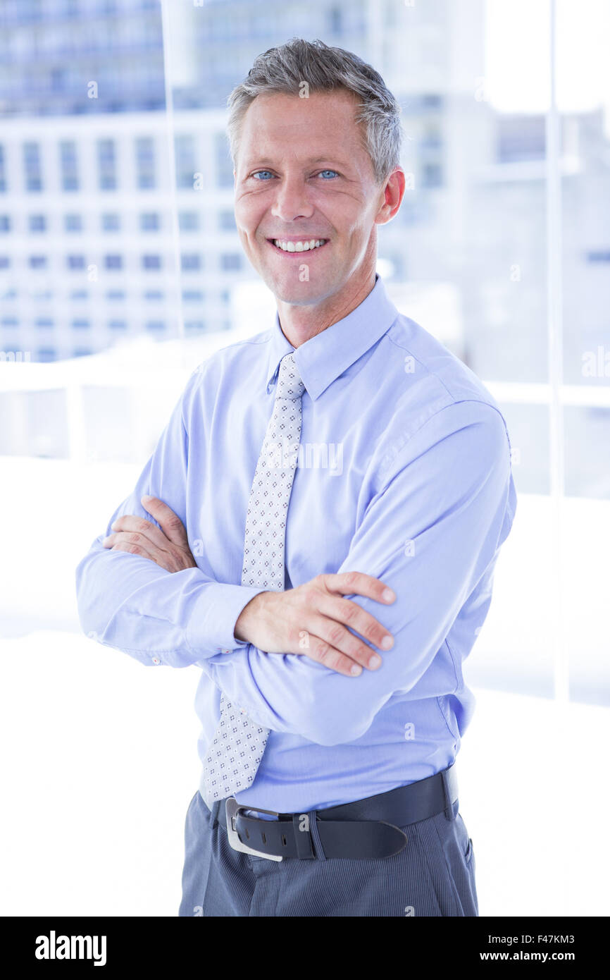Smiling businessman looking at camera Stock Photo - Alamy
