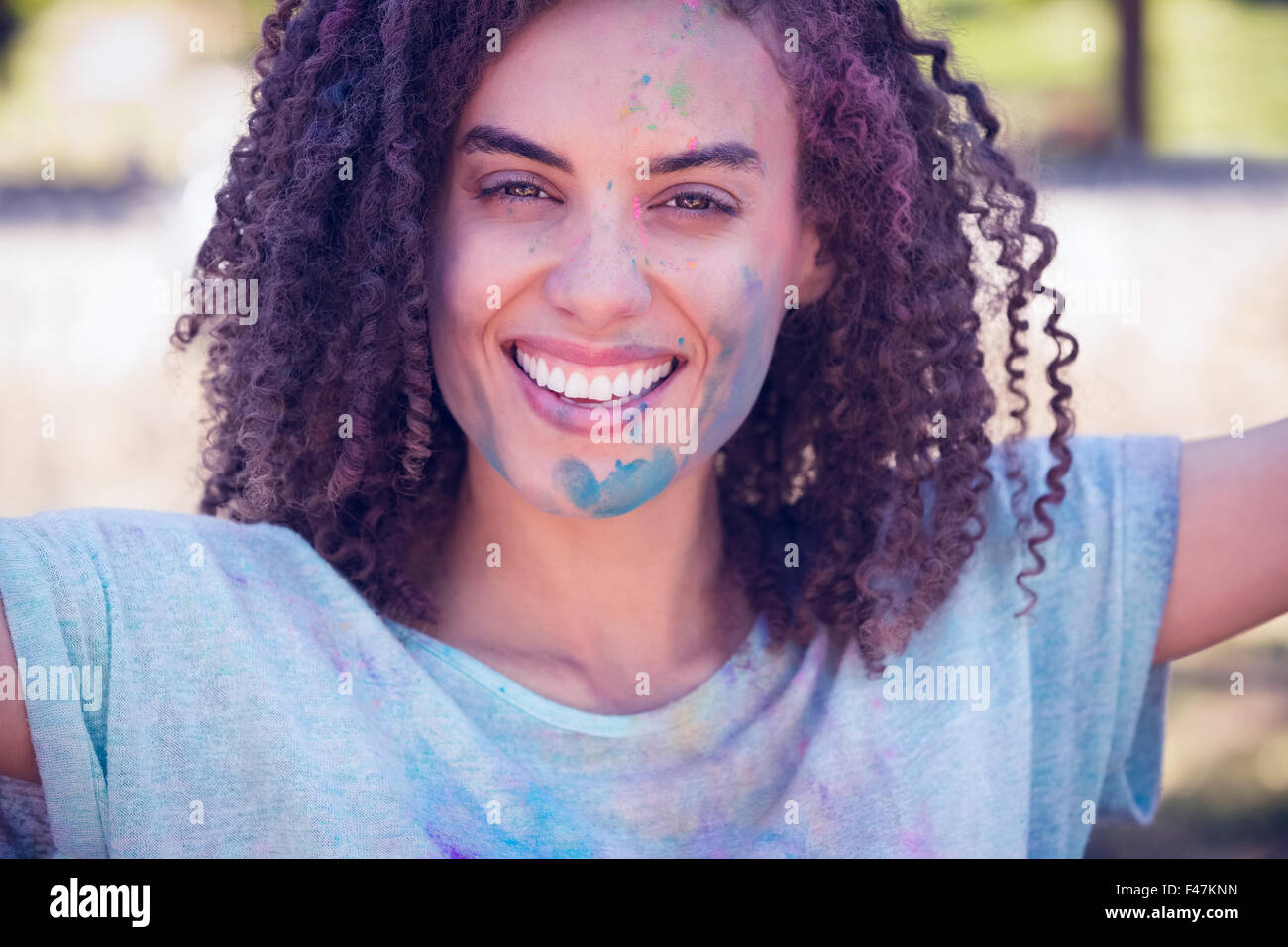 Pretty brunette covered with powder paint Stock Photo - Alamy