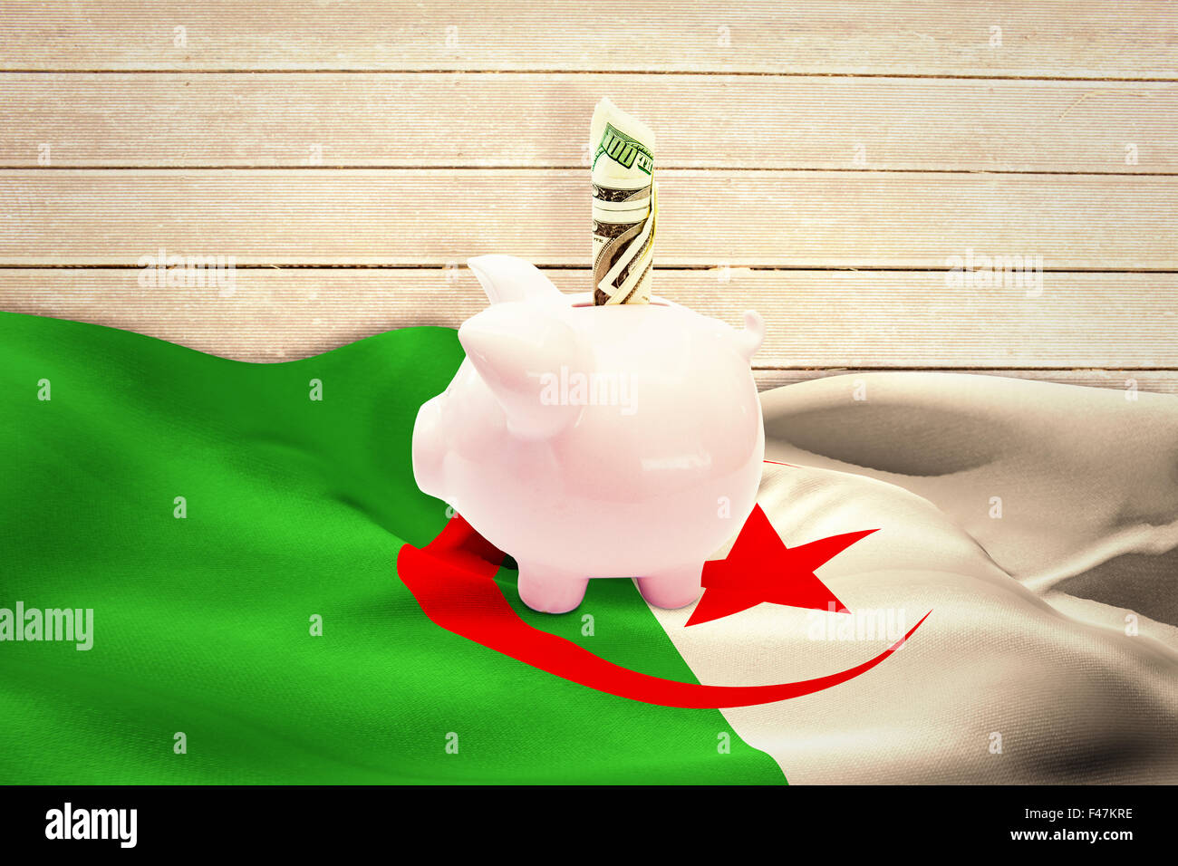 Composite image of dollar in piggy bank Stock Photo
