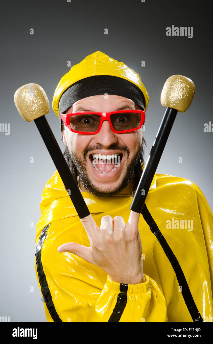 Man wearing yellow suit with mic Stock Photo Alamy
