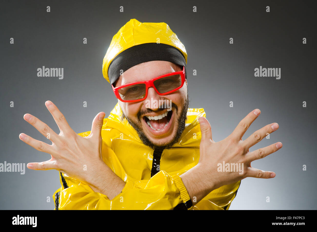 Funny man wearing yellow suit Stock Photo Alamy
