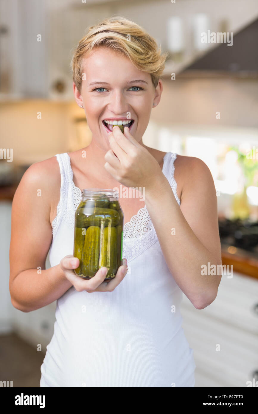 A pregnant woman eating pickles Stock Photo Alamy