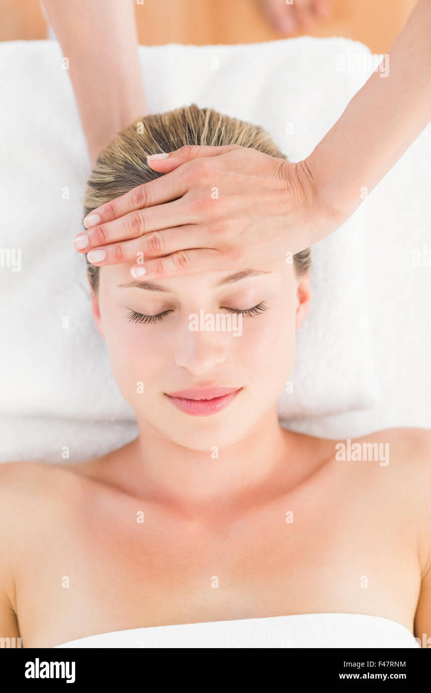 Calm woman receiving reiki treatment Stock Photo - Alamy