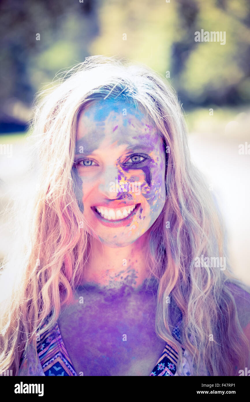 Pretty blonde covered with powder paint Stock Photo - Alamy