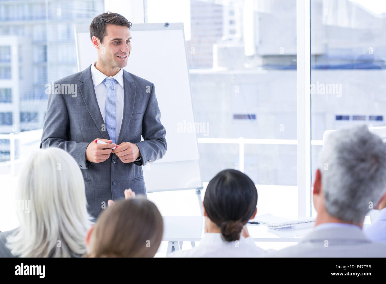 Business team looking at white screen Stock Photo - Alamy