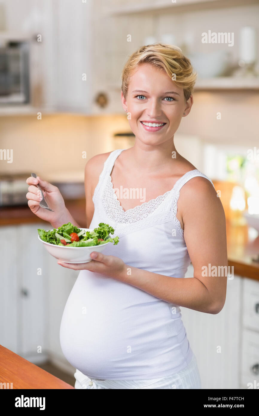 Pregnant woman eating a fresh salad Stock Photo Alamy