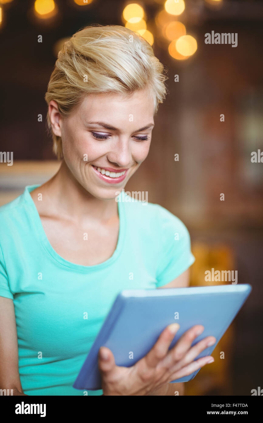 Pretty blonde using tablet computer Stock Photo