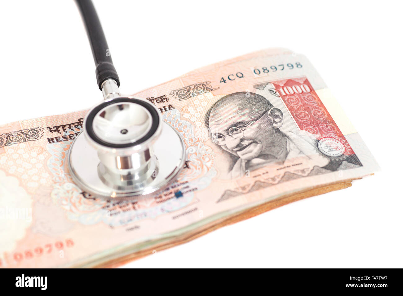 Stethoscope on indian 1000 rupee notes Stock Photo Alamy