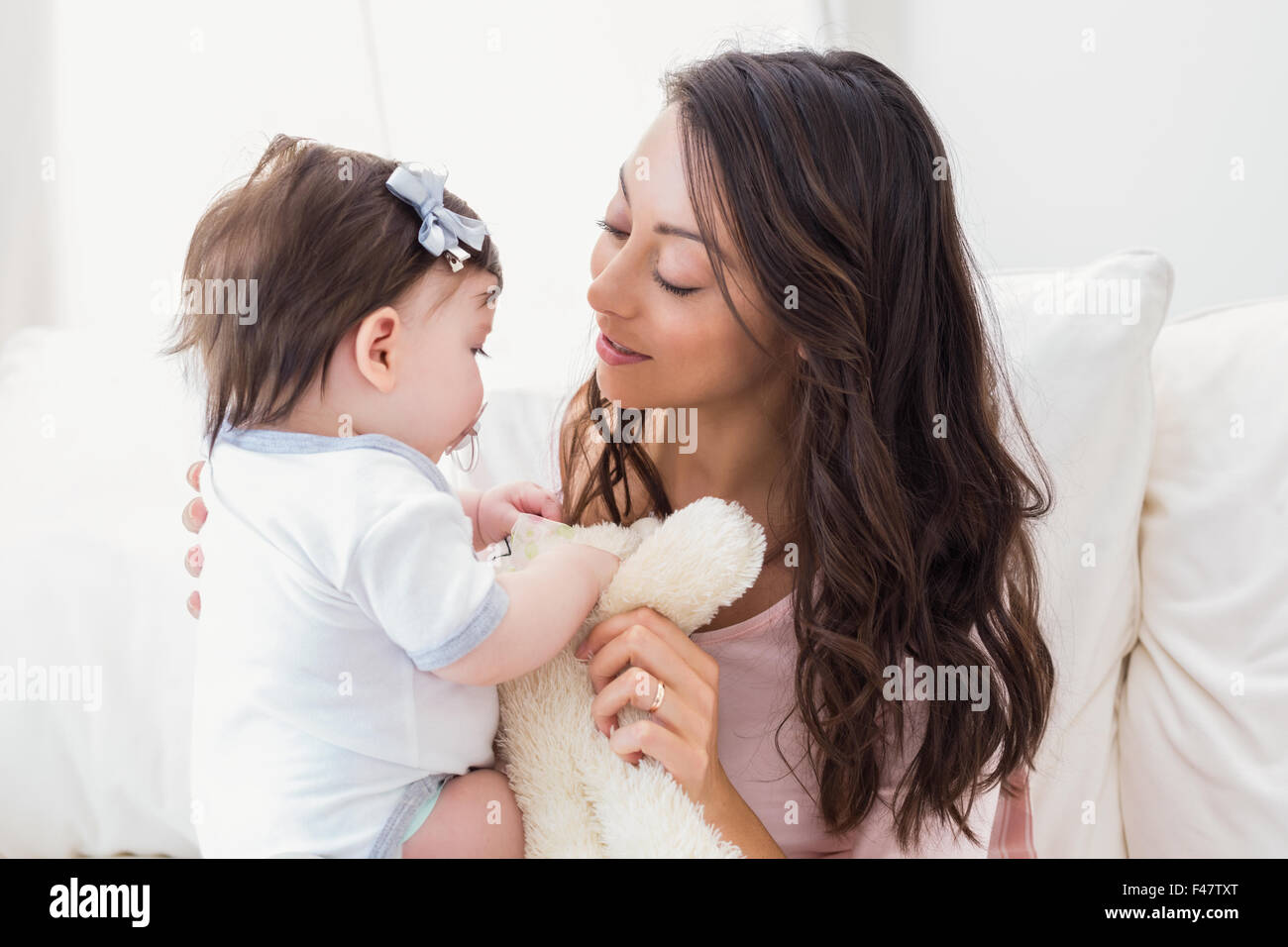 Baby girl smiling playing hi-res stock photography and images - Alamy