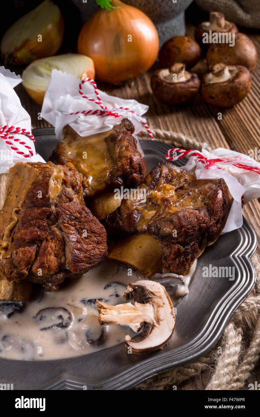 Grilled rinderrippchen with mushroom sauce Stock Photo - Alamy
