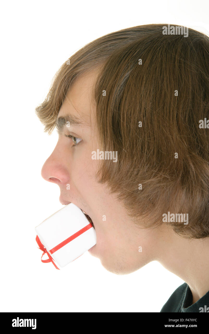 Gift in  mouth at  teenager Stock Photo