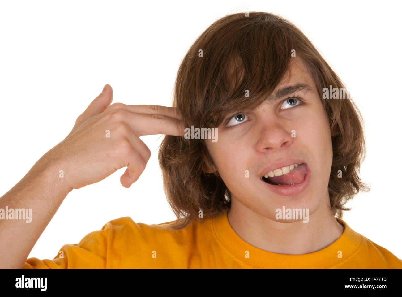 Teenager has put hand fingers to head Stock Photo
