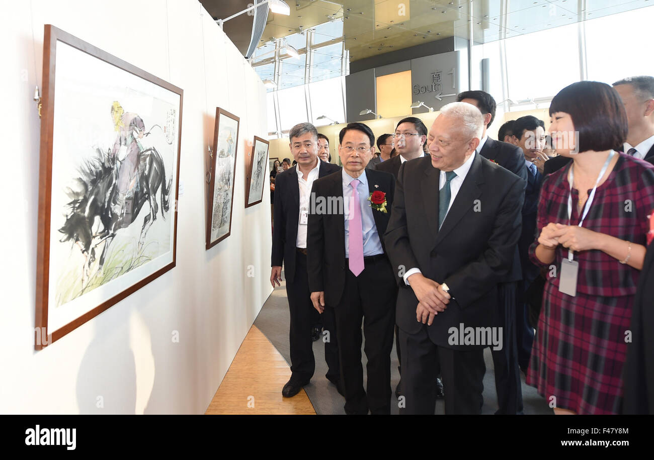 Hong Kong, China. 15th Oct, 2015. Tung Chee-hwa (front, 2nd R), vice chairman of the National Committee of the Chinese People's Political Consultative Conference, views artworks during a painting and calligraphy exhibition in Hong Kong, south China, Oct. 15, 2015. The three-day exhibition, displaying hundreds of classical artworks from famous artists in modern and contemporary age, opened here Thursday. © Lui Siu Wai/Xinhua/Alamy Live News Stock Photo