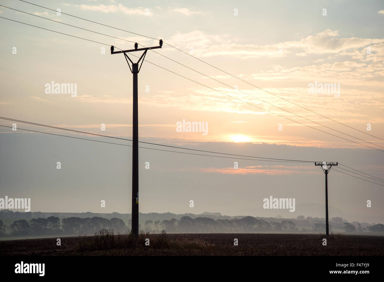 sunrise sky over power lines at Tatras Stock Photo