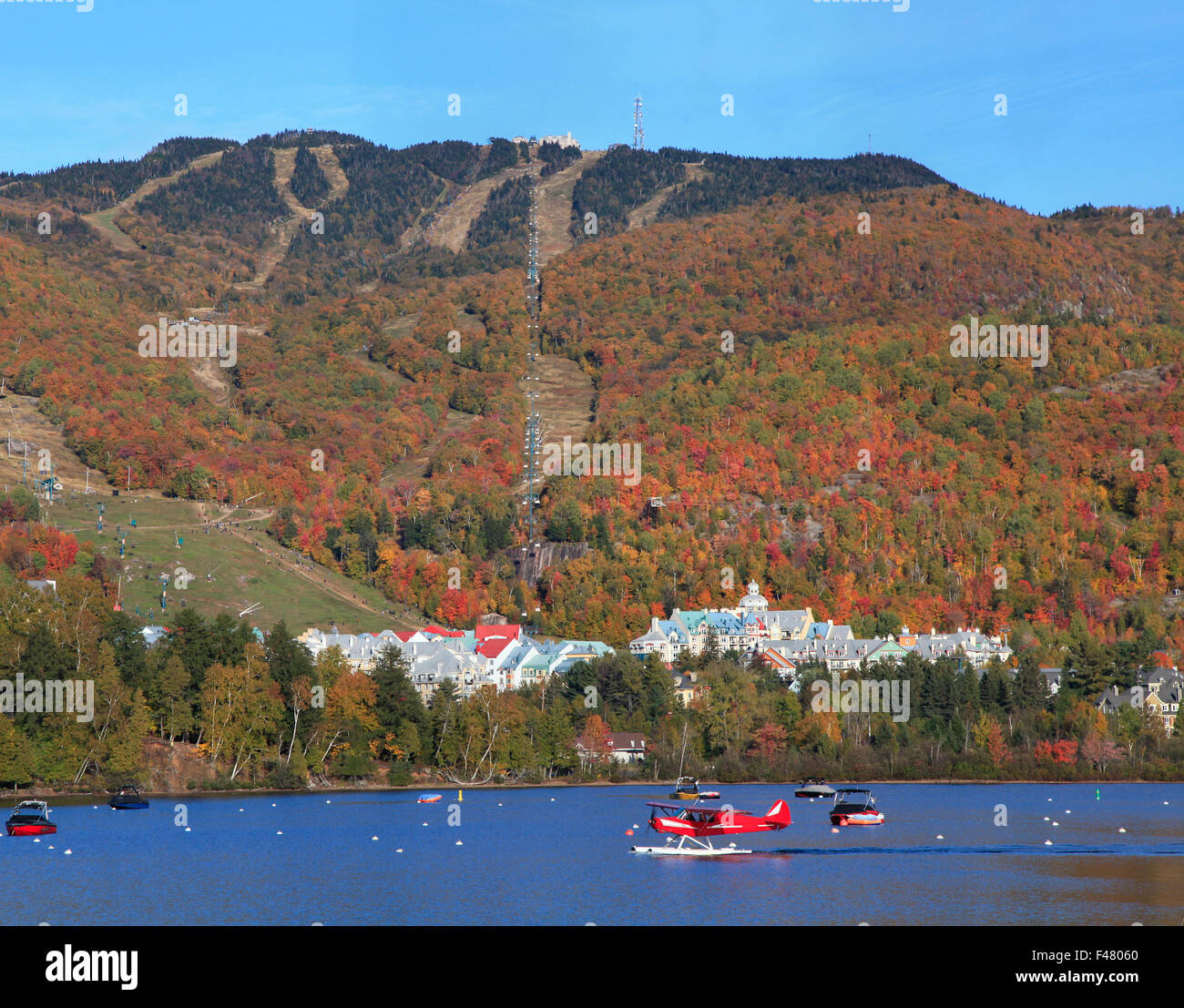 mont-tremblant-lake-and-village-with-autumn-colors-quebec-stock-photo