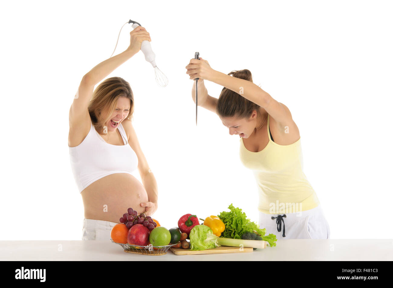 Two women are preparing to attack the fruit Stock Photo