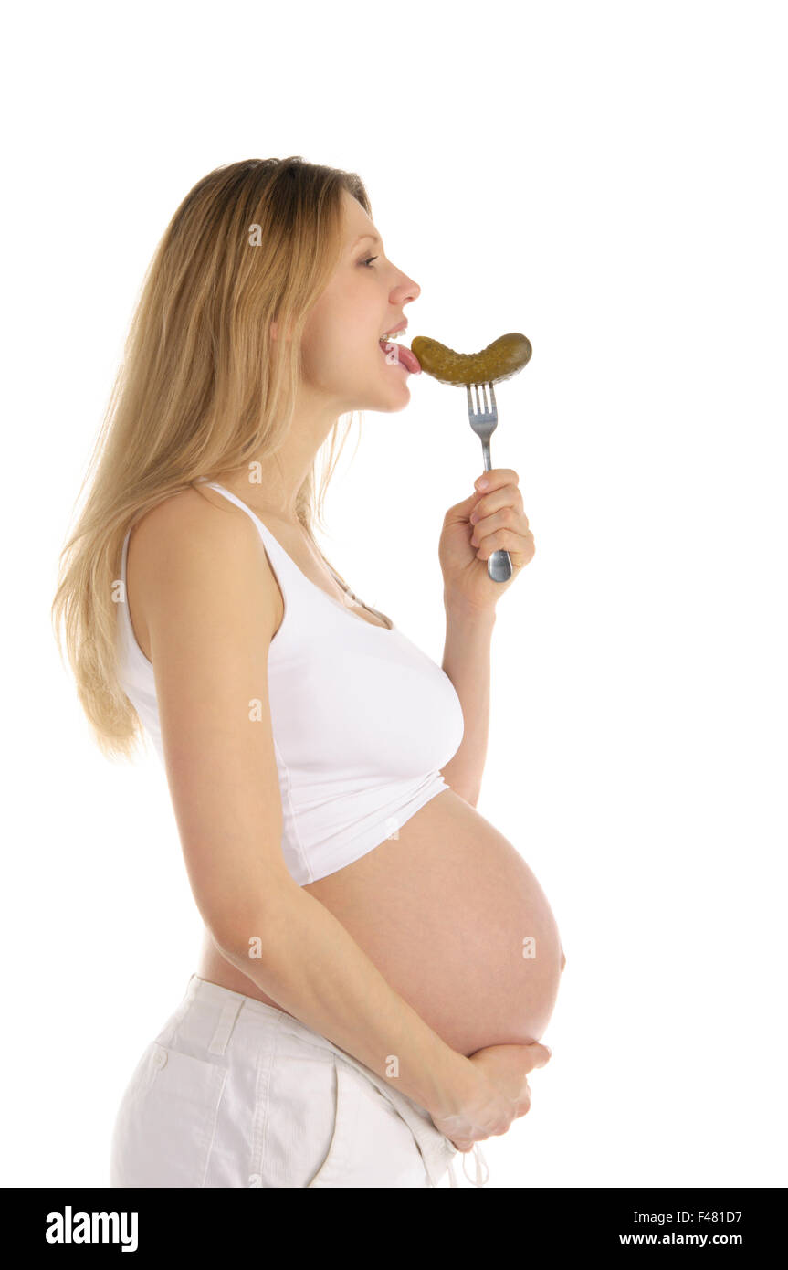 pregnant woman licks pickle Stock Photo