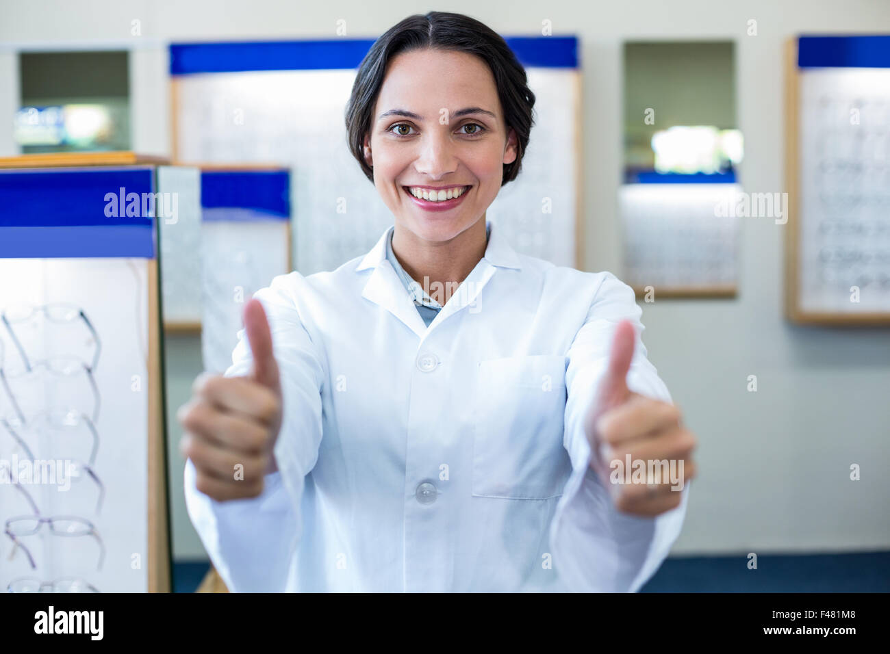 A female optician thumbs up Stock Photo Alamy
