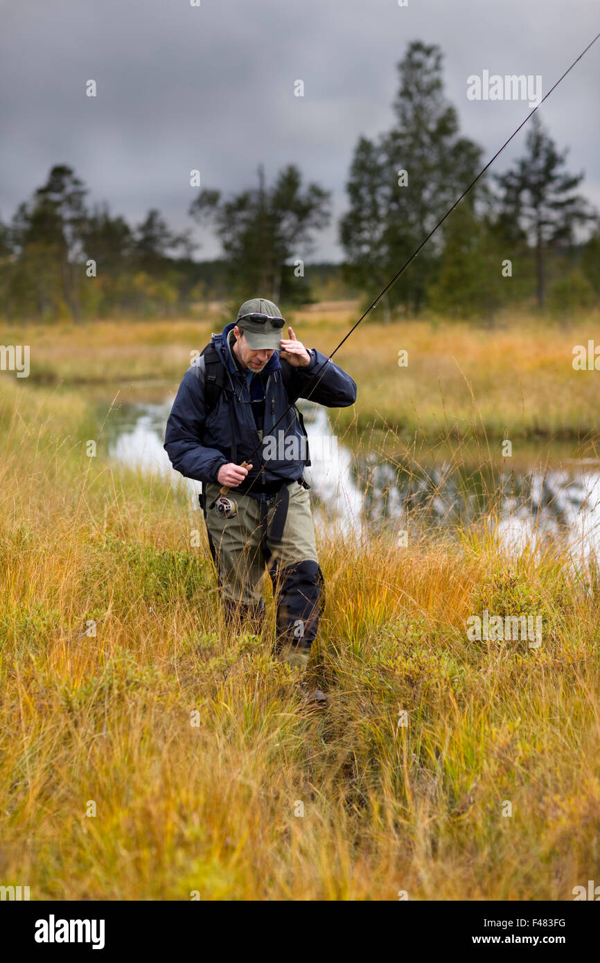 A man fly-fishing, Sweden Stock Photo - Alamy