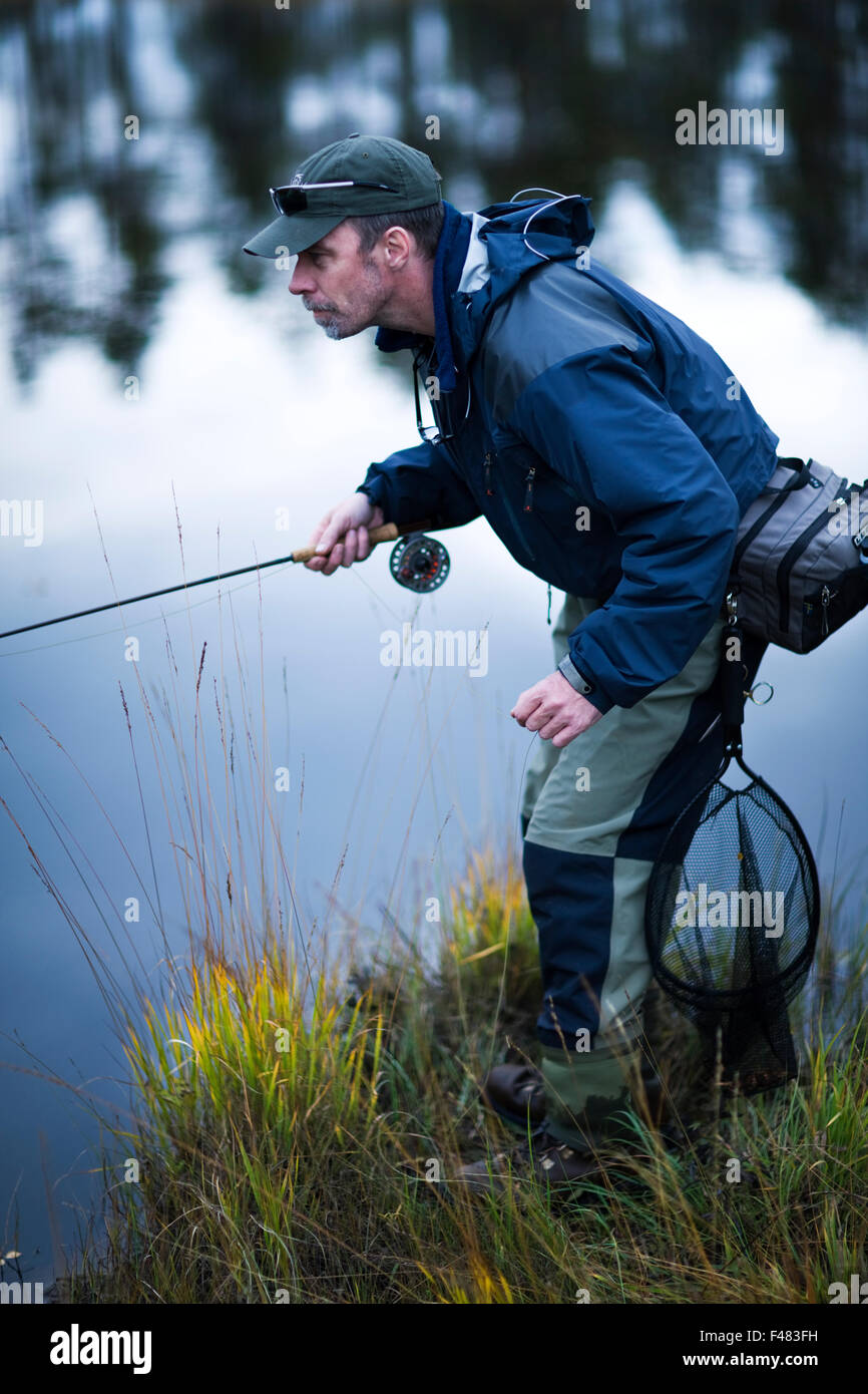 A man fly-fishing, Sweden Stock Photo - Alamy