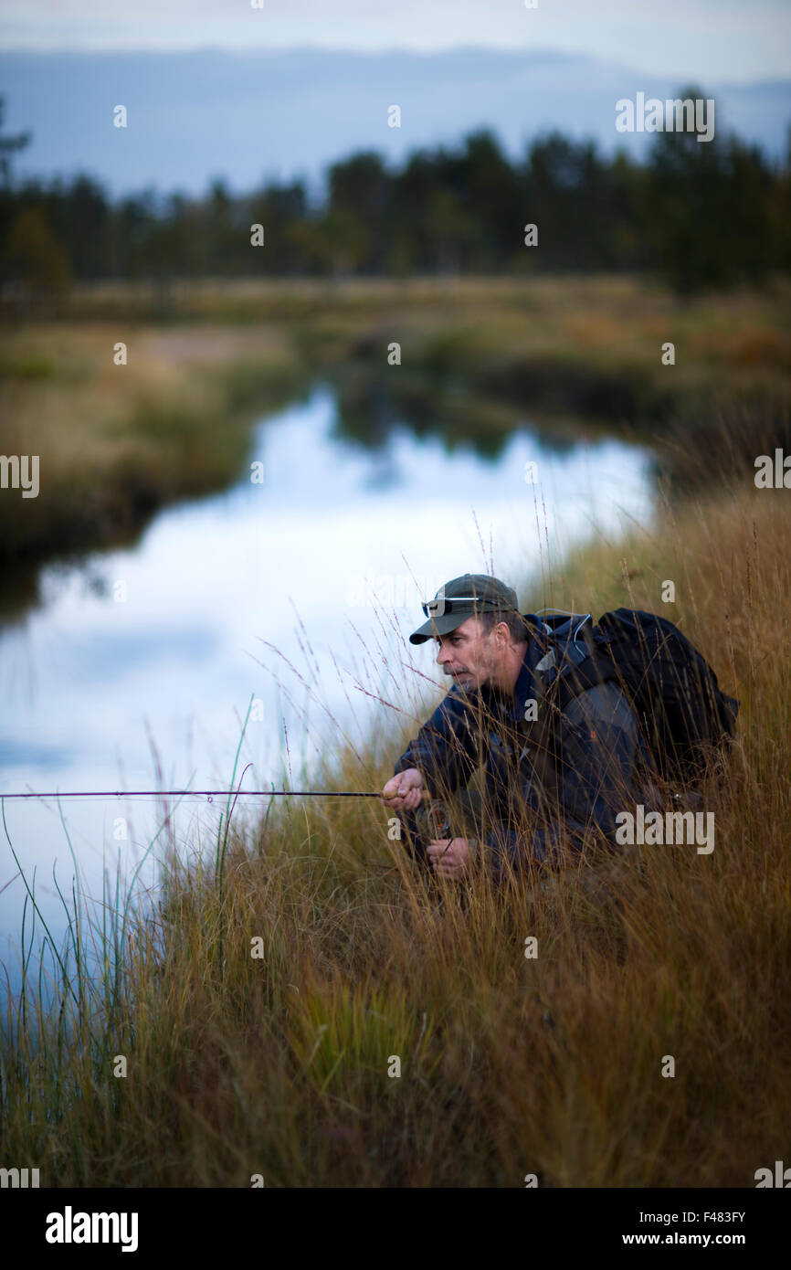 A man fly-fishing, Sweden Stock Photo - Alamy