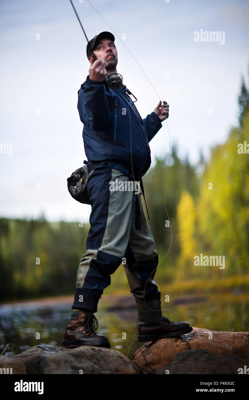 A man fly-fishing, Sweden Stock Photo - Alamy