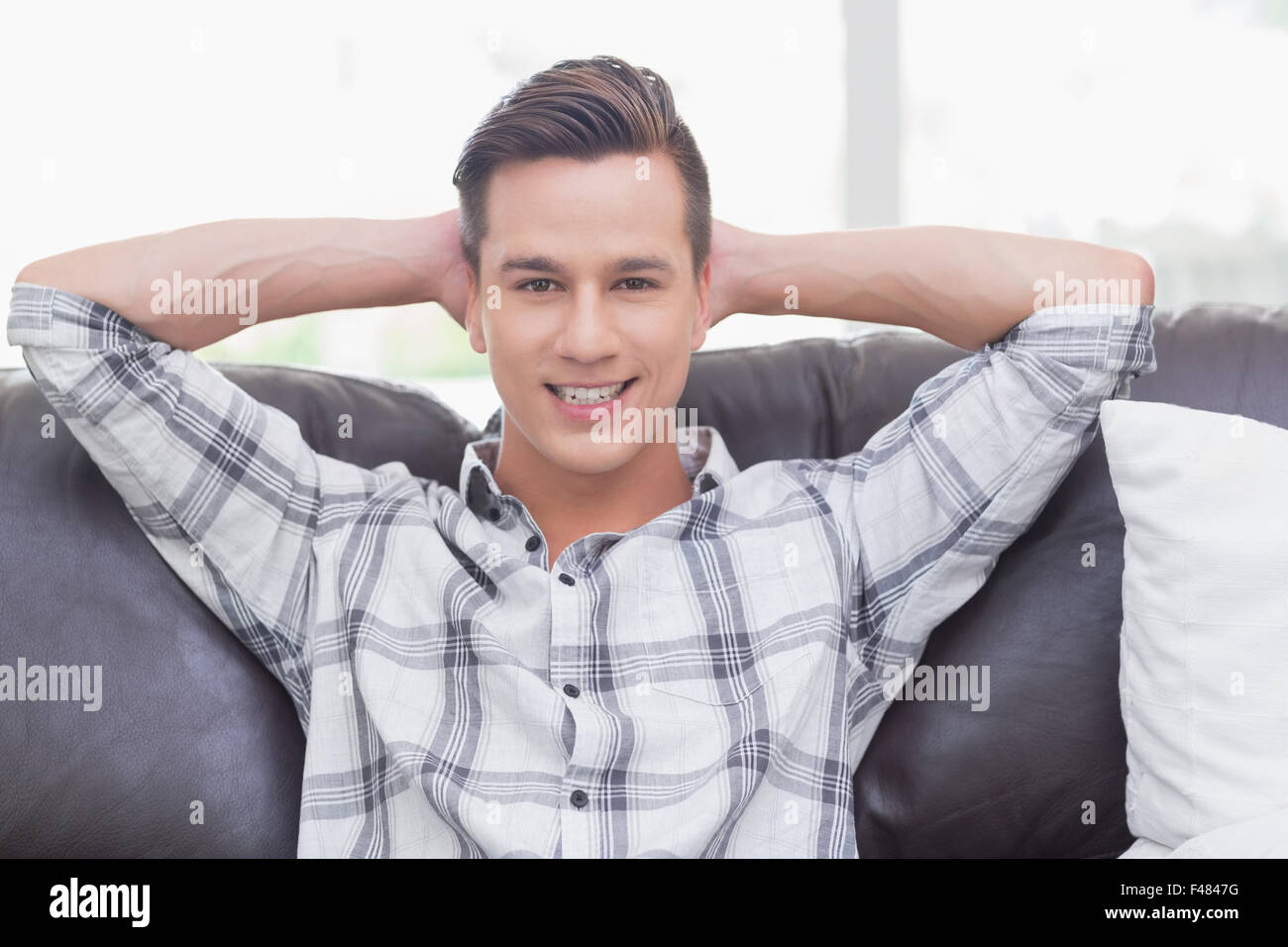 Relaxed handsome man looking at the camera Stock Photo