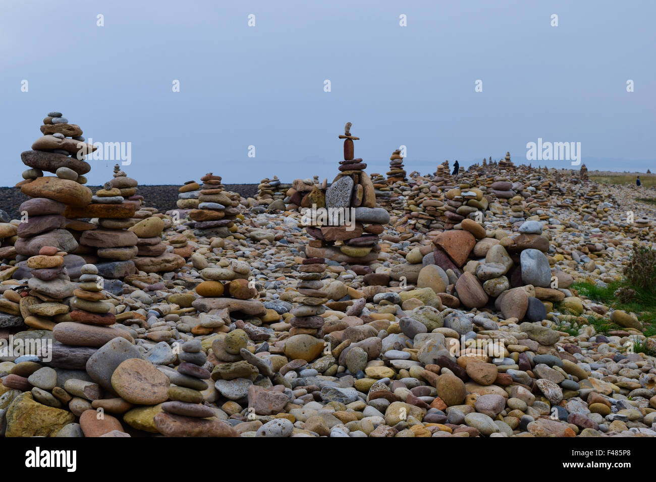 Stone cairns on beach on Lindisfarne, Northumberland. Stock Photo