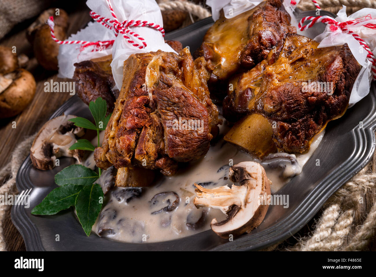 Grilled rinderrippchen with mushroom sauce Stock Photo - Alamy
