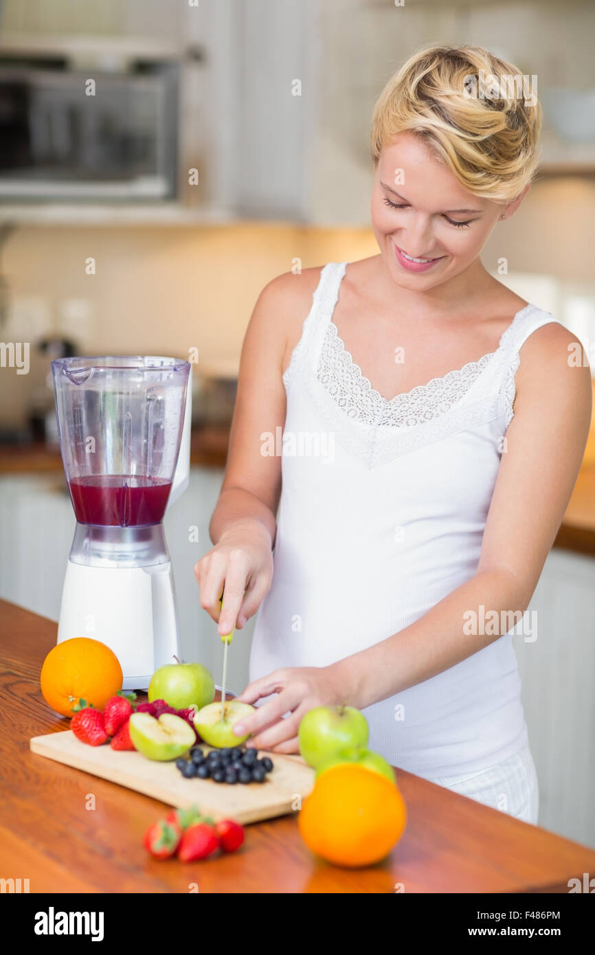 Pregnant woman preparing a fruit juice Stock Photo Alamy