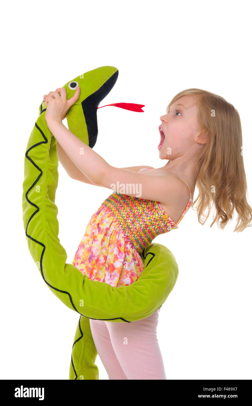 girl fights with toy snake Stock Photo