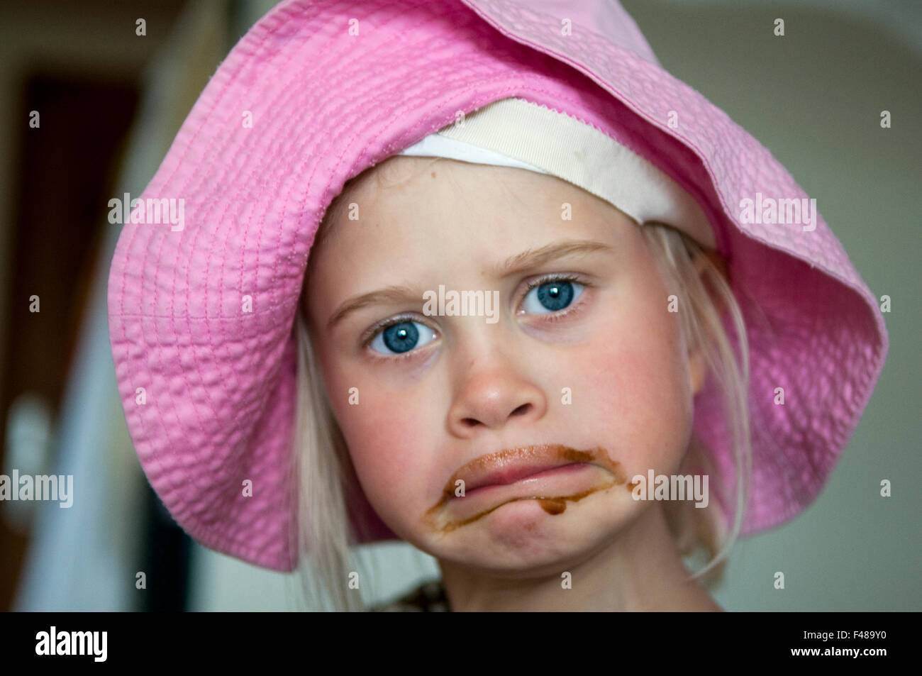 Girl with smeary with chocolate, Guadeloupe. Stock Photo