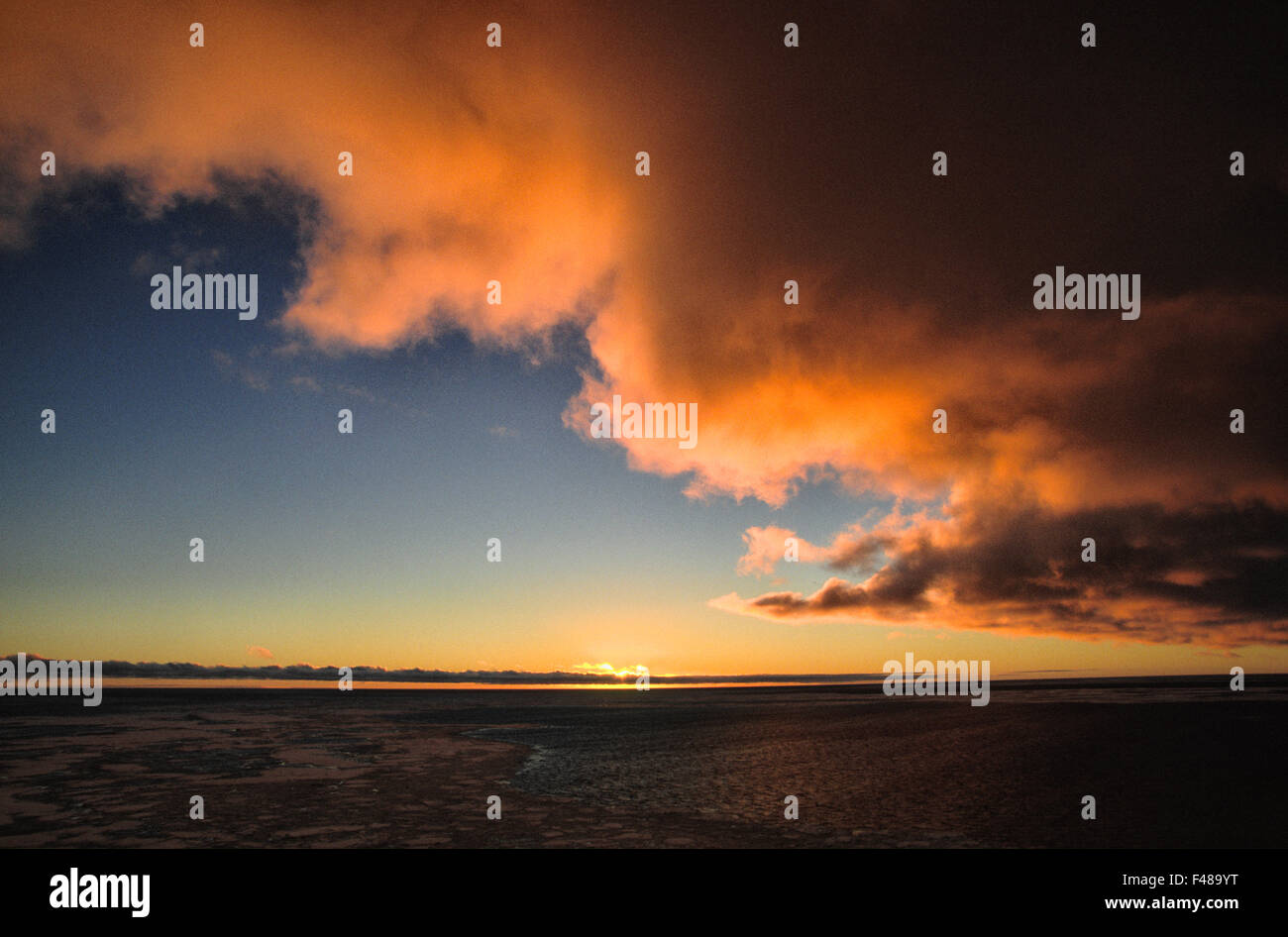 Sun setting by the sea, the Antarctic. Stock Photo
