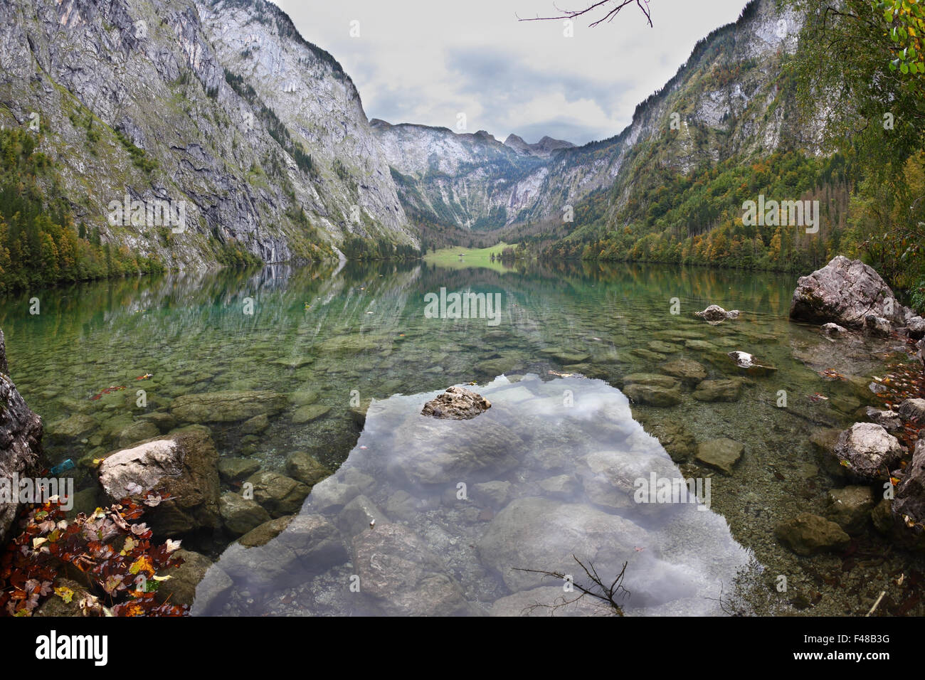 Cloudy sky reflected in lake Stock Photo - Alamy