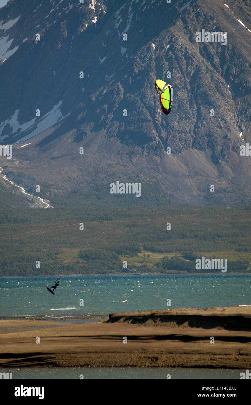 Kite-surfing in front of a mountain, Norway. Stock Photo