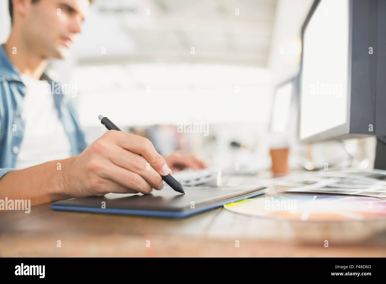 Graphic designer using a graphics tablet Stock Photo - Alamy
