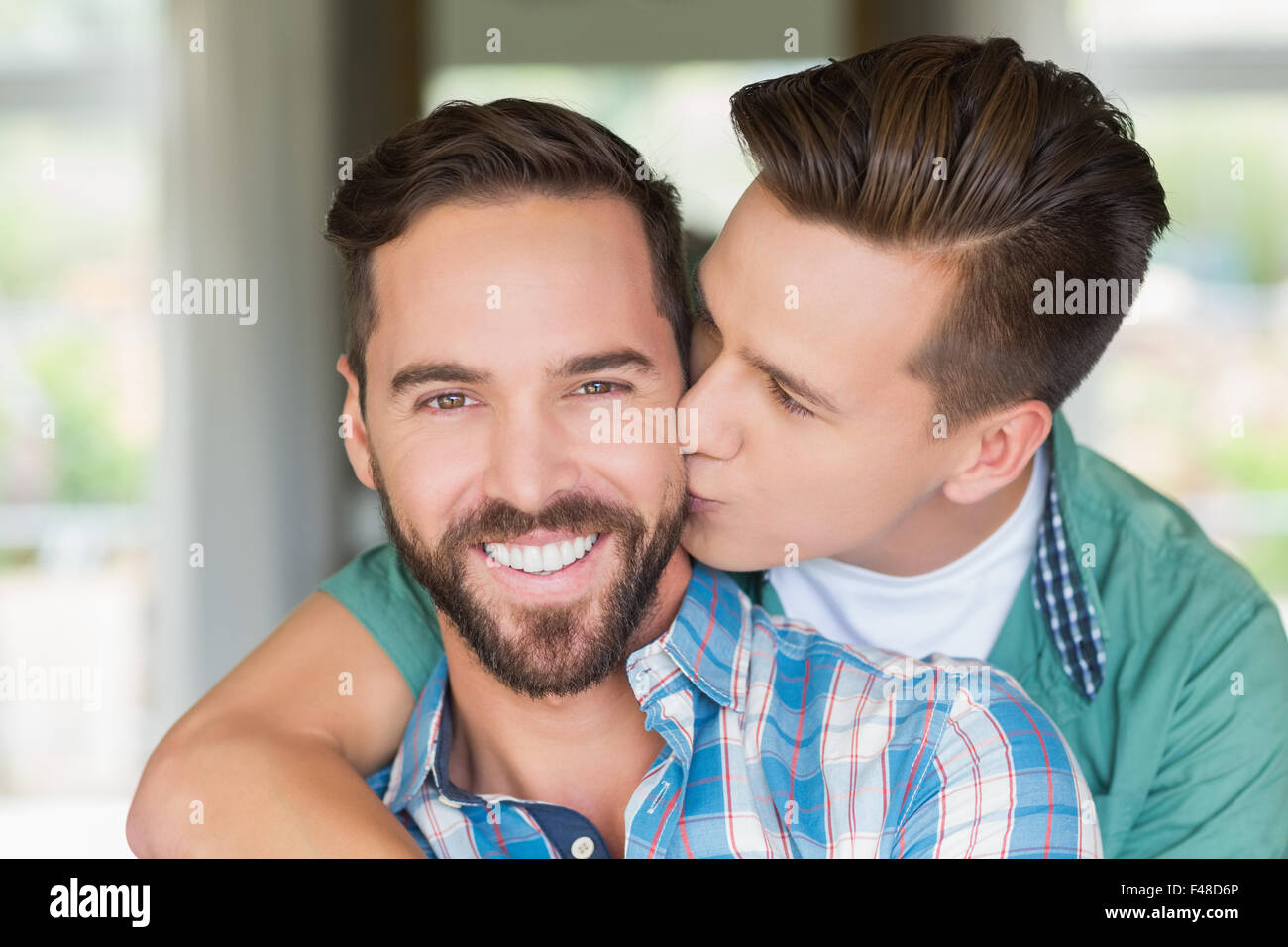Homosexual couple men kissing each other Stock Photo