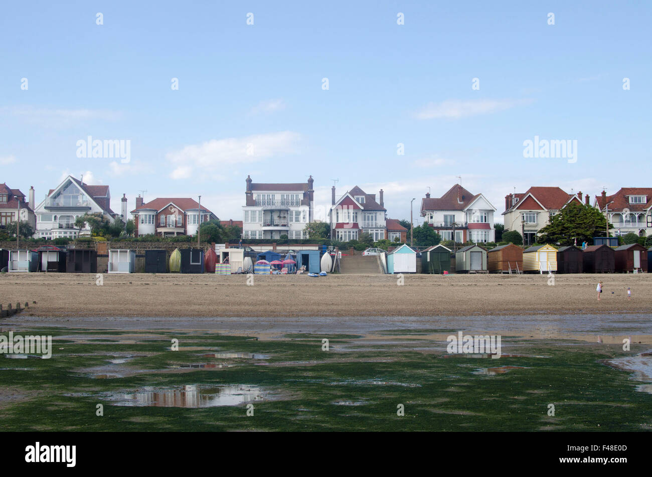 Beach huts and houses on the seafront in Thorpe Bay, Essex Stock Photo