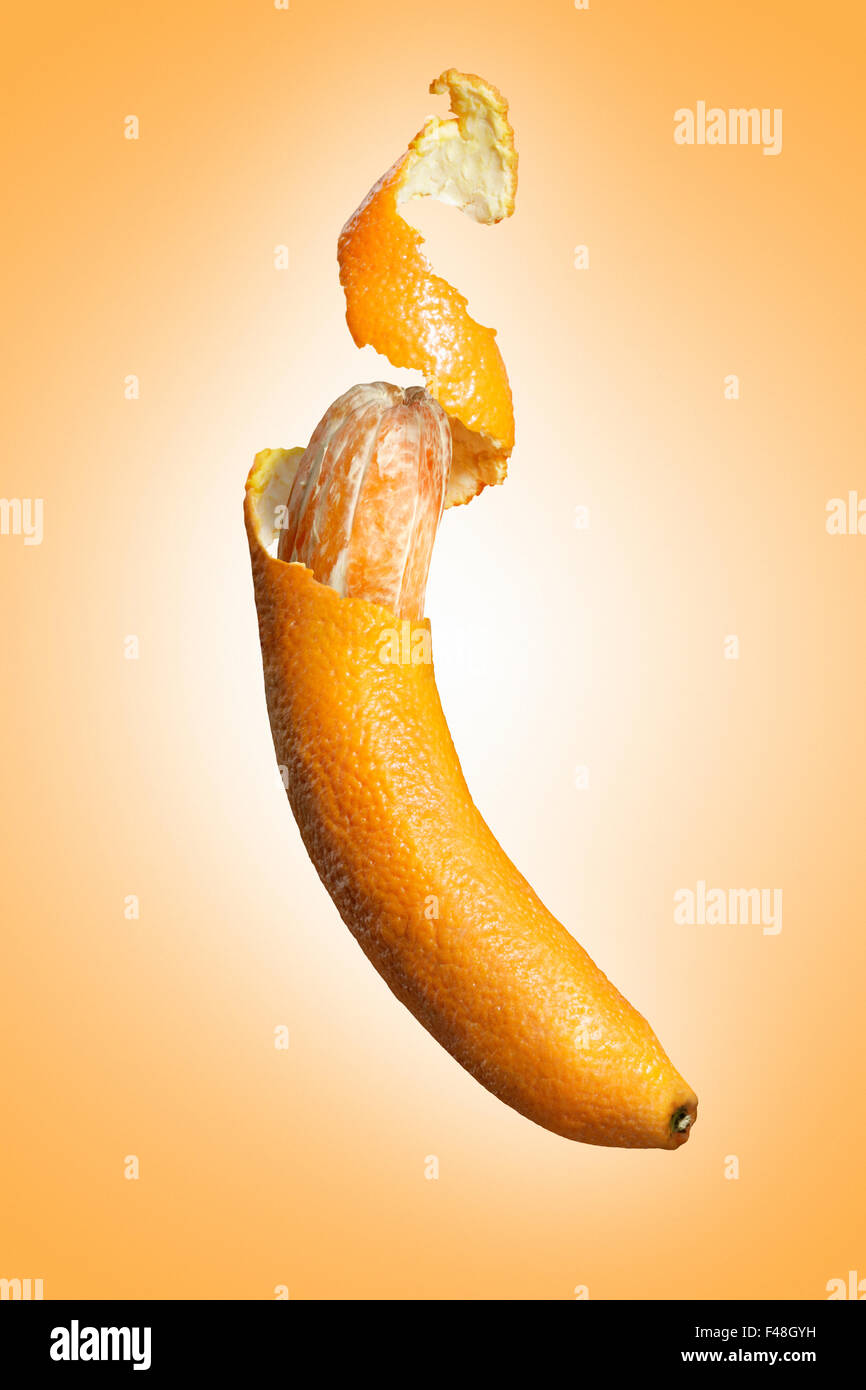 An orange shaped as a banana. Stock Photo