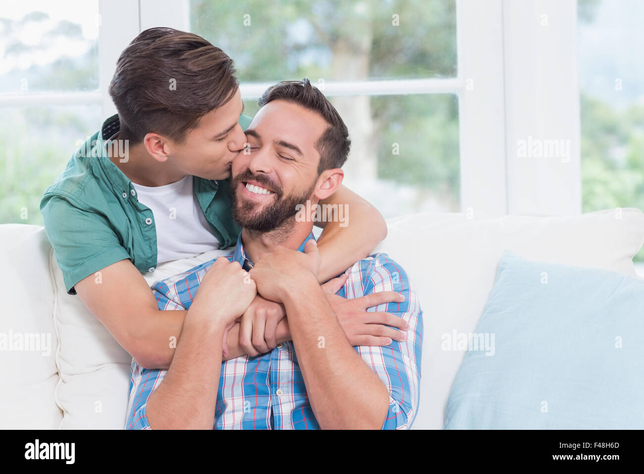 gay men kissing each other