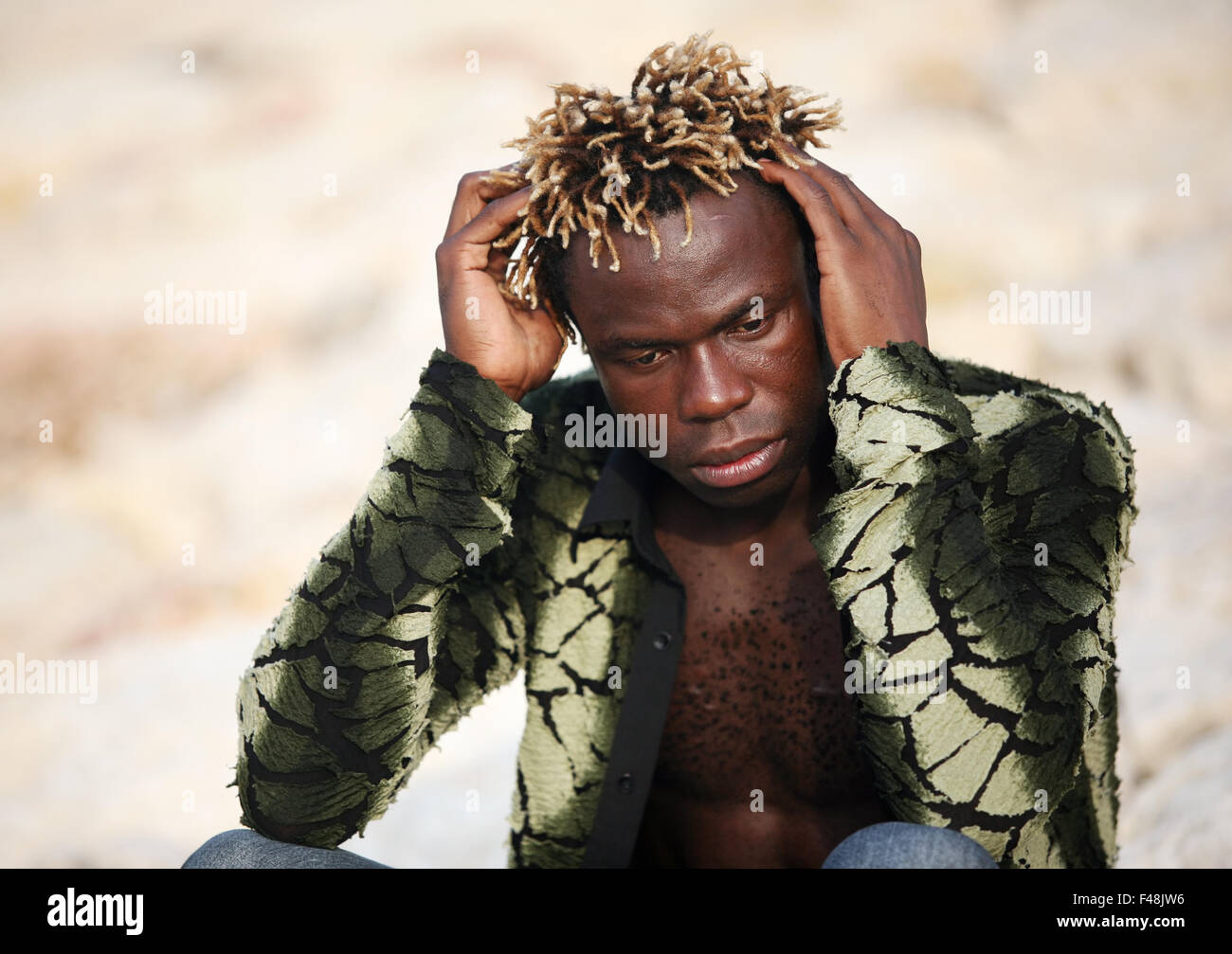 Portrait of young sad man Stock Photo - Alamy