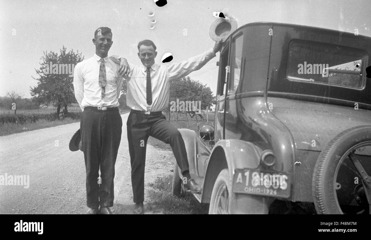 brothers posing with 1930s car Stock Photo